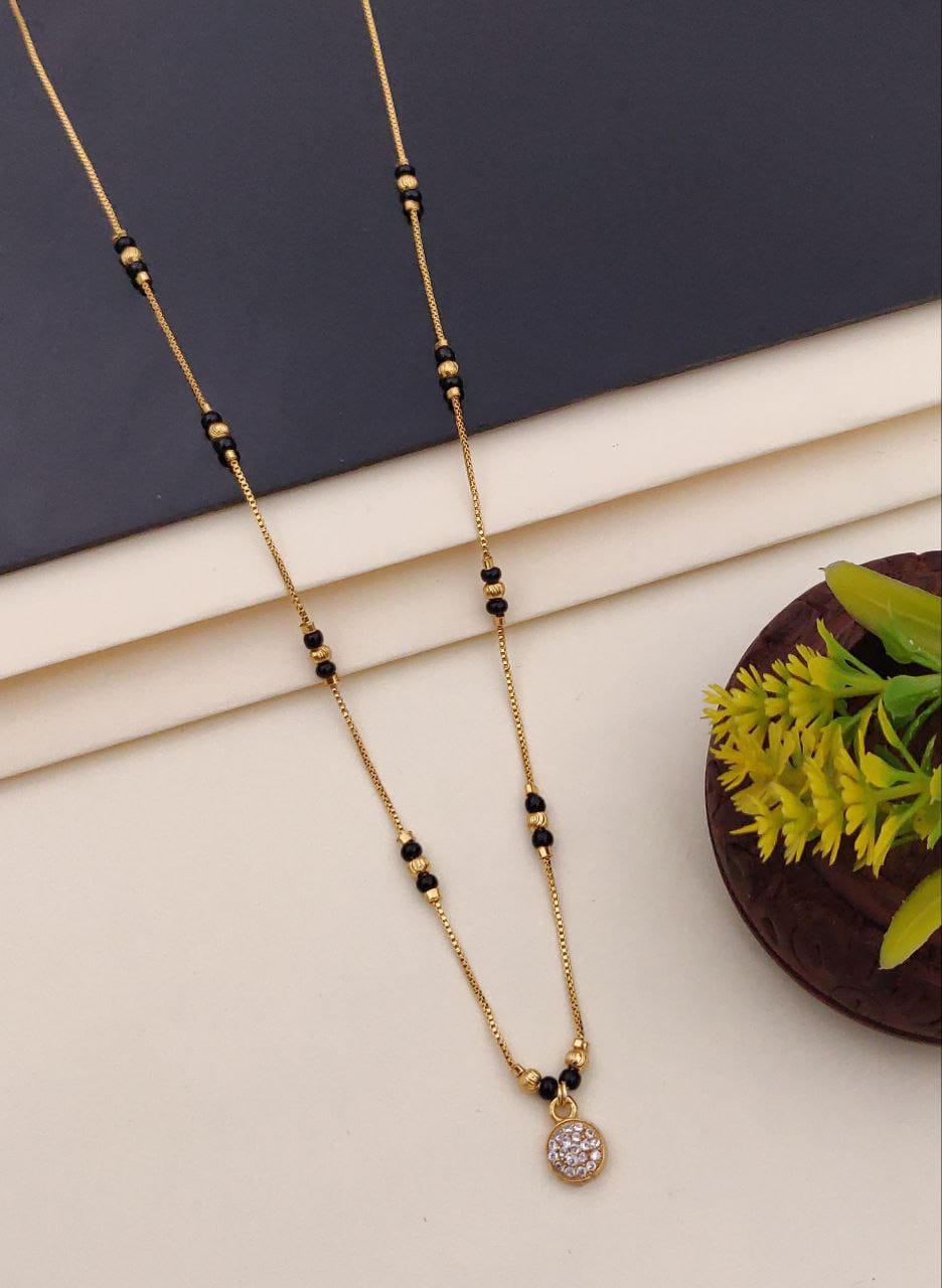 Elegant black bead mangalsutra necklace displayed on a white surface