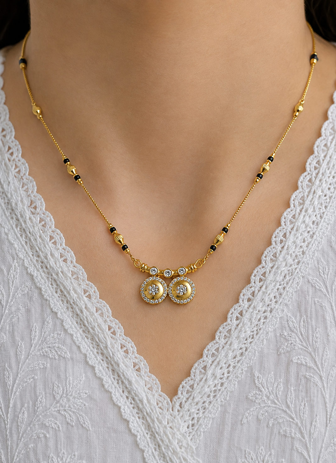 Elegant gold-tone mangalsutra necklace for women with black beads and double circle pendant