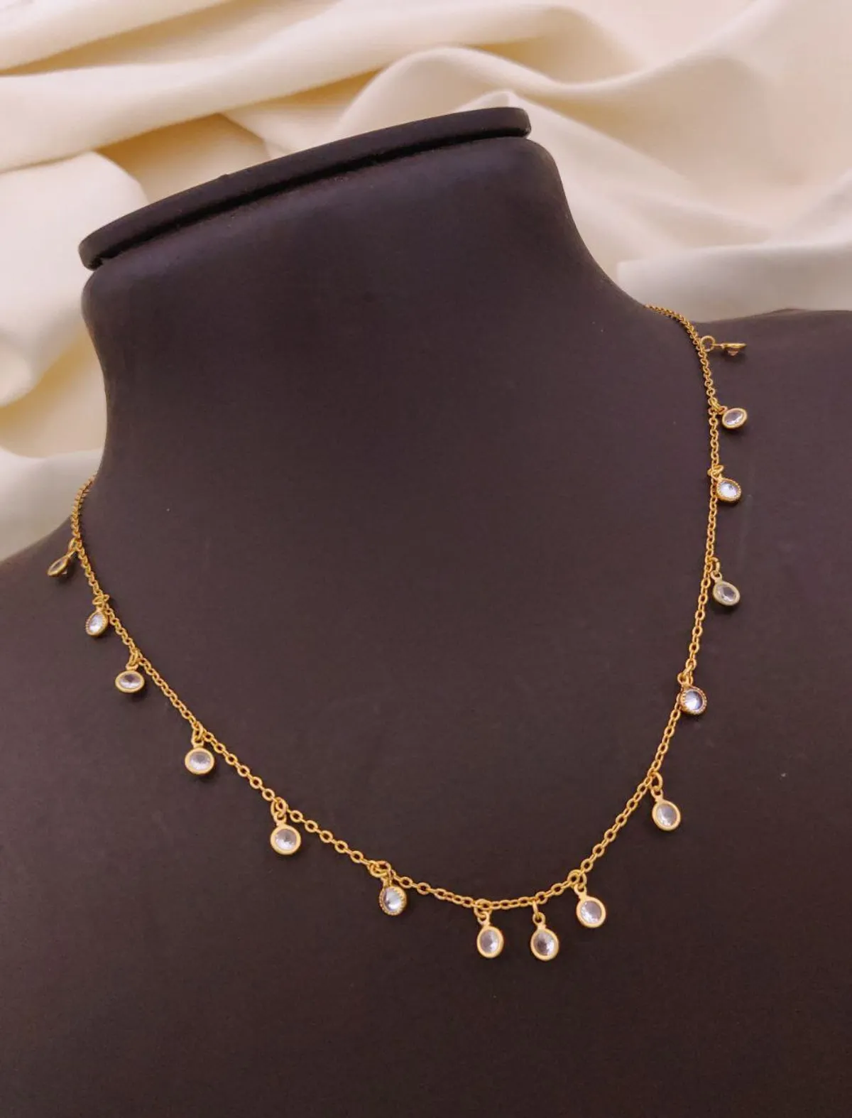 Elegant gold chain necklace with clear crystal drop charms for women